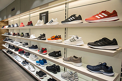 pngtree-wide-selection-of-athletic-shoes-in-retail-store-display-image_17172528